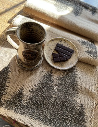Hand glazed pottery with pen and ink table runner